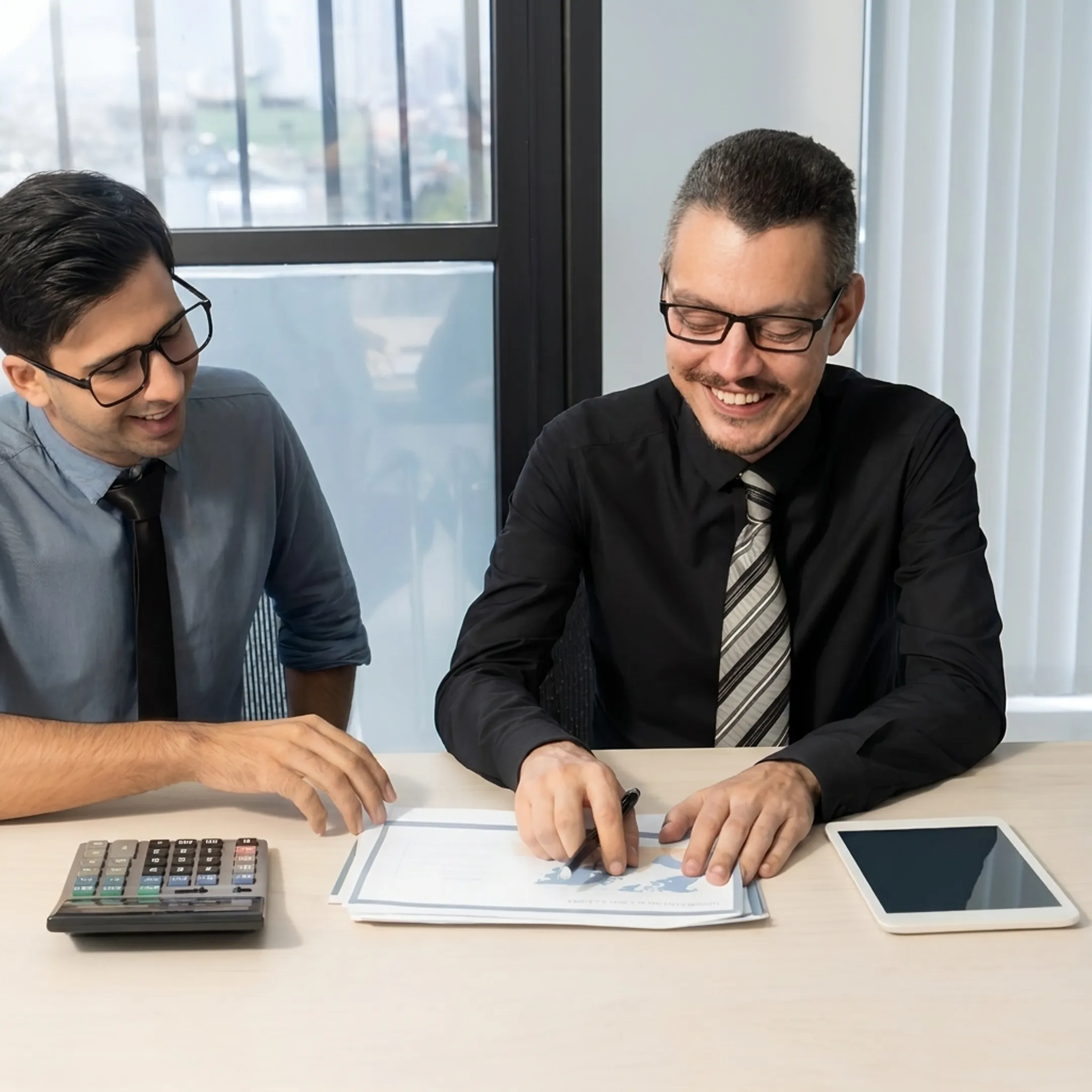 Financial consultant reviewing accounting reports with a client