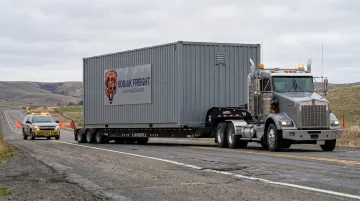 Heavy-haul truck transporting oversize containerized data center module