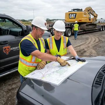 Heavy-haul team planning construction equipment transport