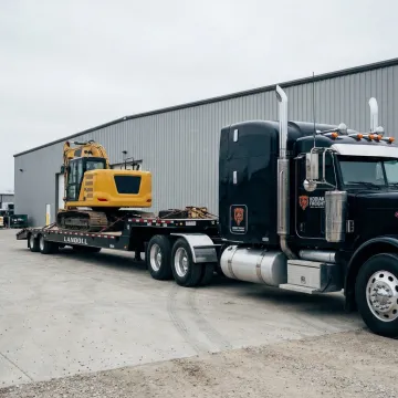 Dedicated freight truck hauling industrial equipment