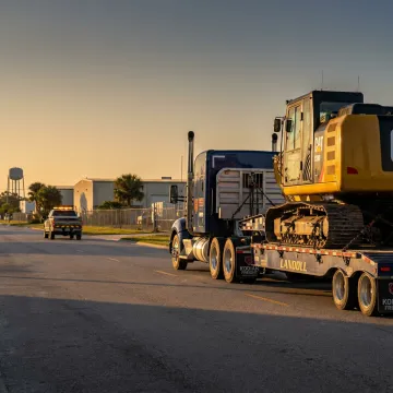 Heavy haul truck transporting oversized equipment in Orlando
