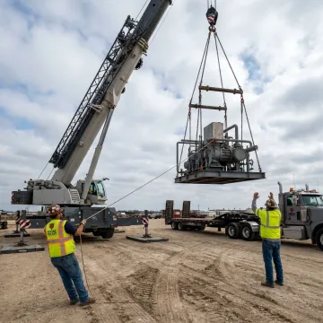 Industrial crane lifting heavy equipment