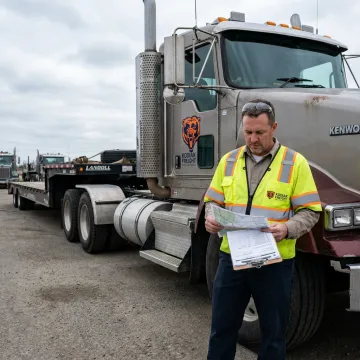 Freight coordinator planning a heavy-haul shipment