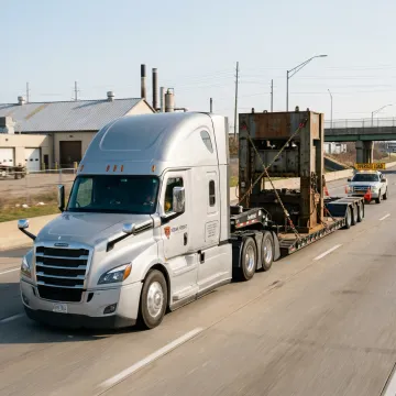 Heavy haul truck transporting oversized equipment in Michigan