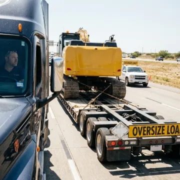 Oversized heavy equipment on specialized transport trailer