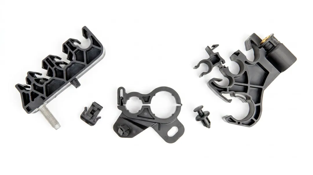 Automotive injection molded plastic components including housings fasteners and connectors