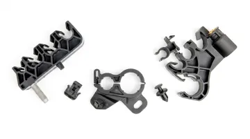 Automotive injection molded plastic components including housings fasteners and connectors