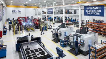 Krupa Services integrated fabrication facility showing laser cutting and CNC machining operations