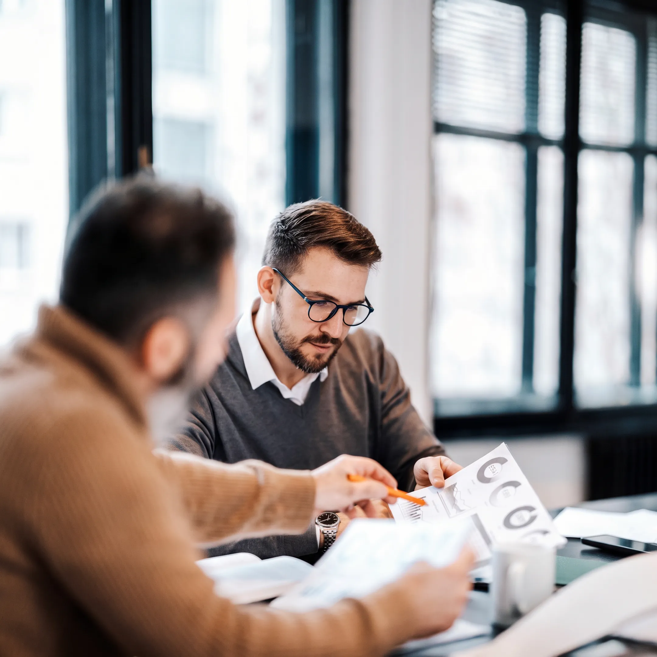 Advisor presenting personalized portfolio strategy to client