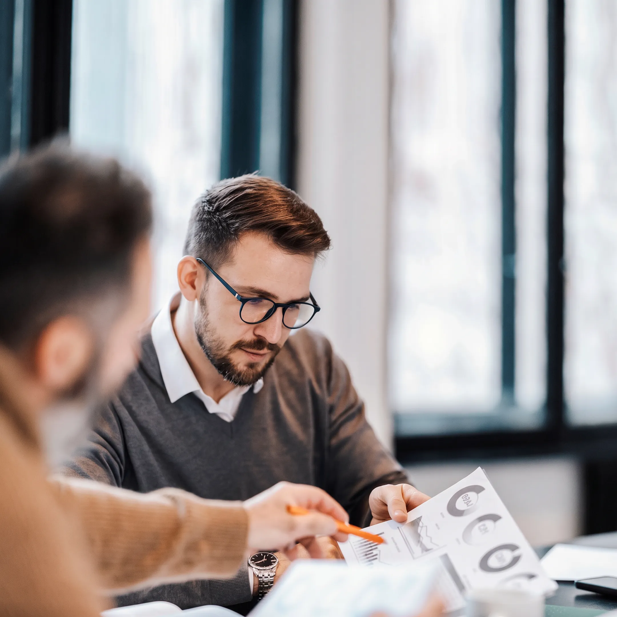 Financial advisor presenting a personalized investment portfolio review