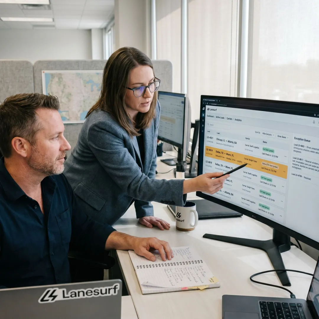 Freight operations team reviewing tracking visibility dashboard