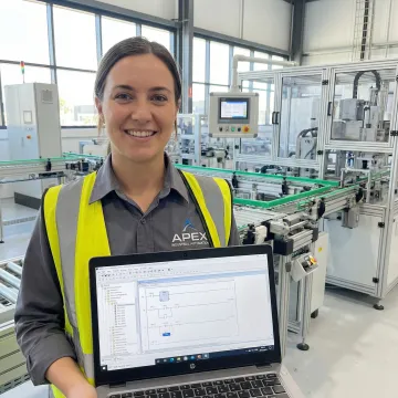 Industrial engineer programming PLC automation system