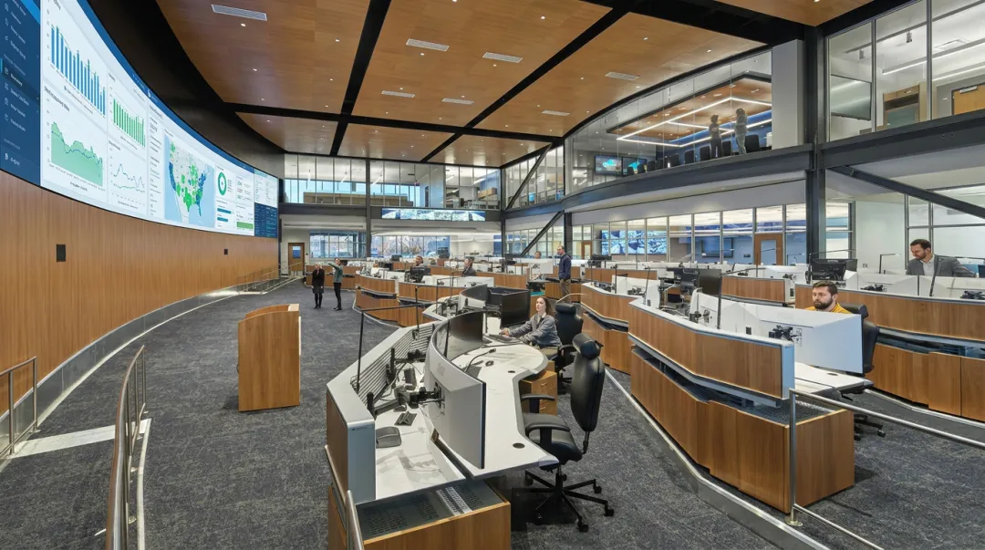 Large hotel management company operations center with revenue management team at workstations