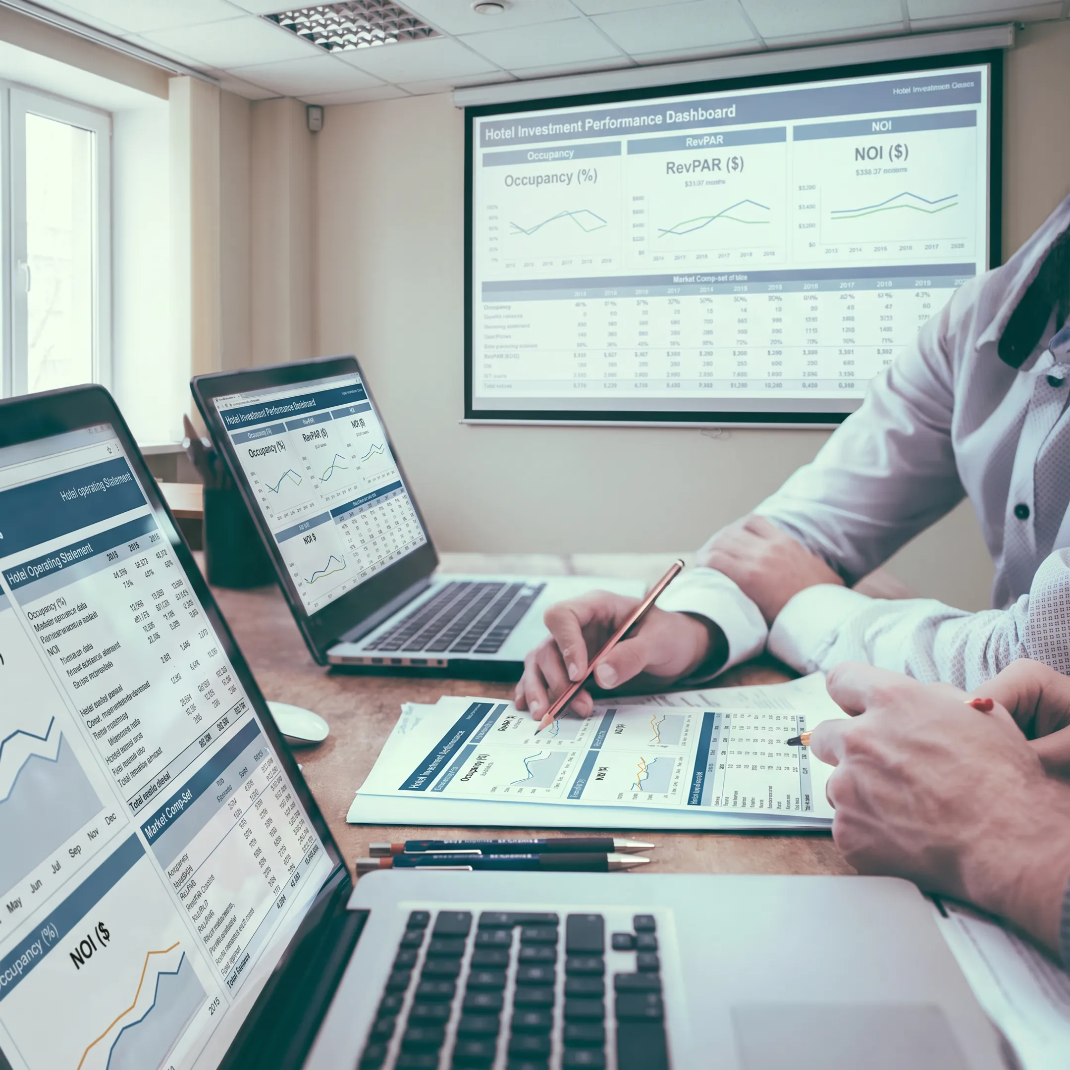 Asset management team reviewing hotel financial performance