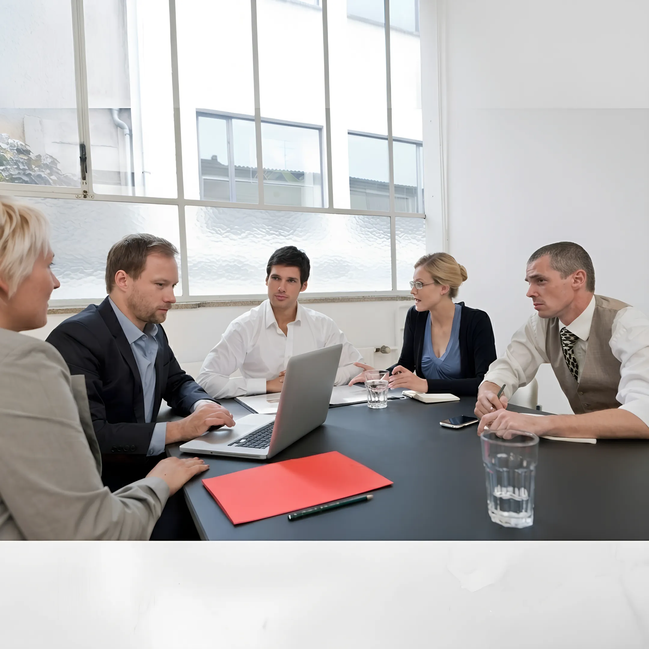 Executive coach mentoring a business director in an executive office