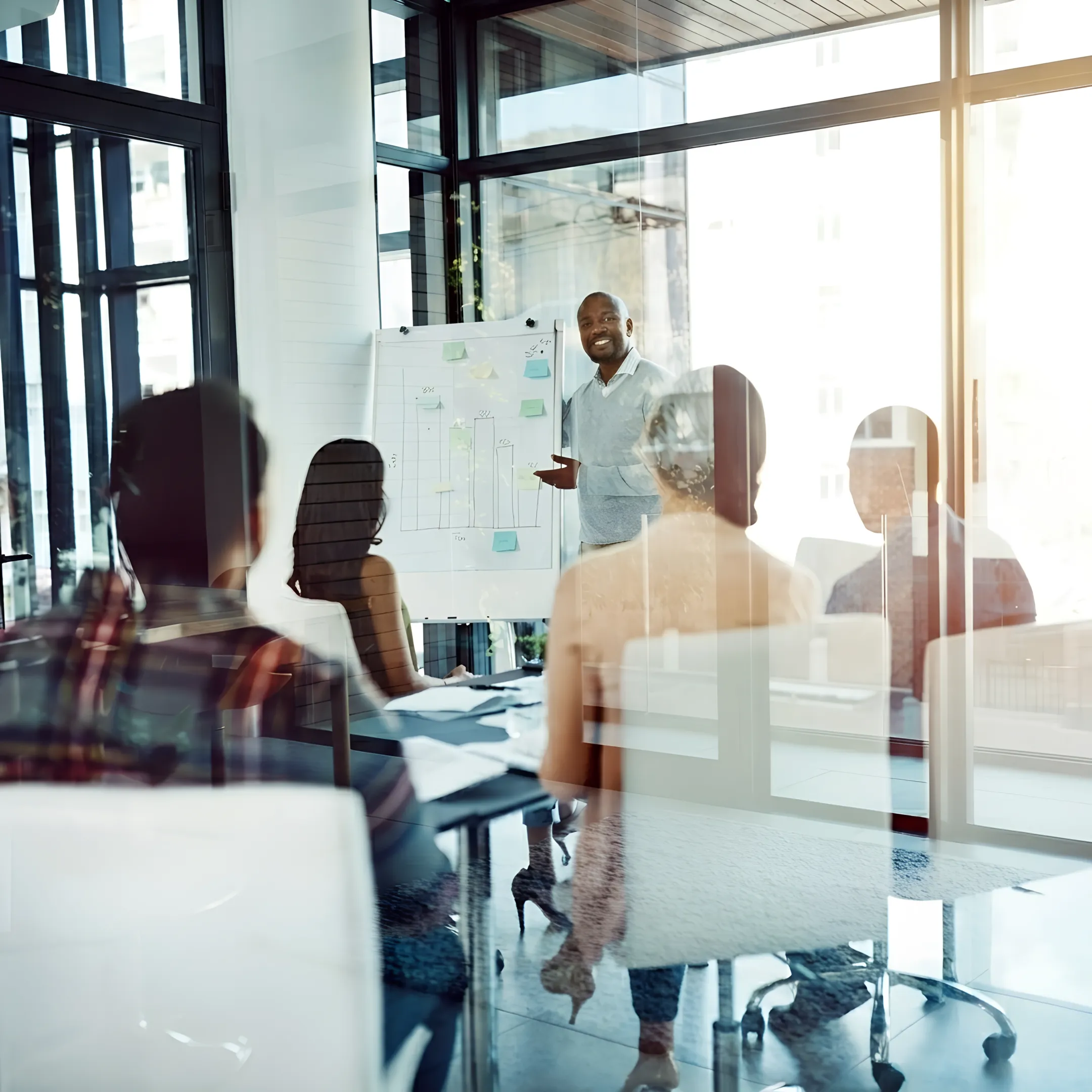 Management instructor guiding corporate leaders through strategic decision matrix