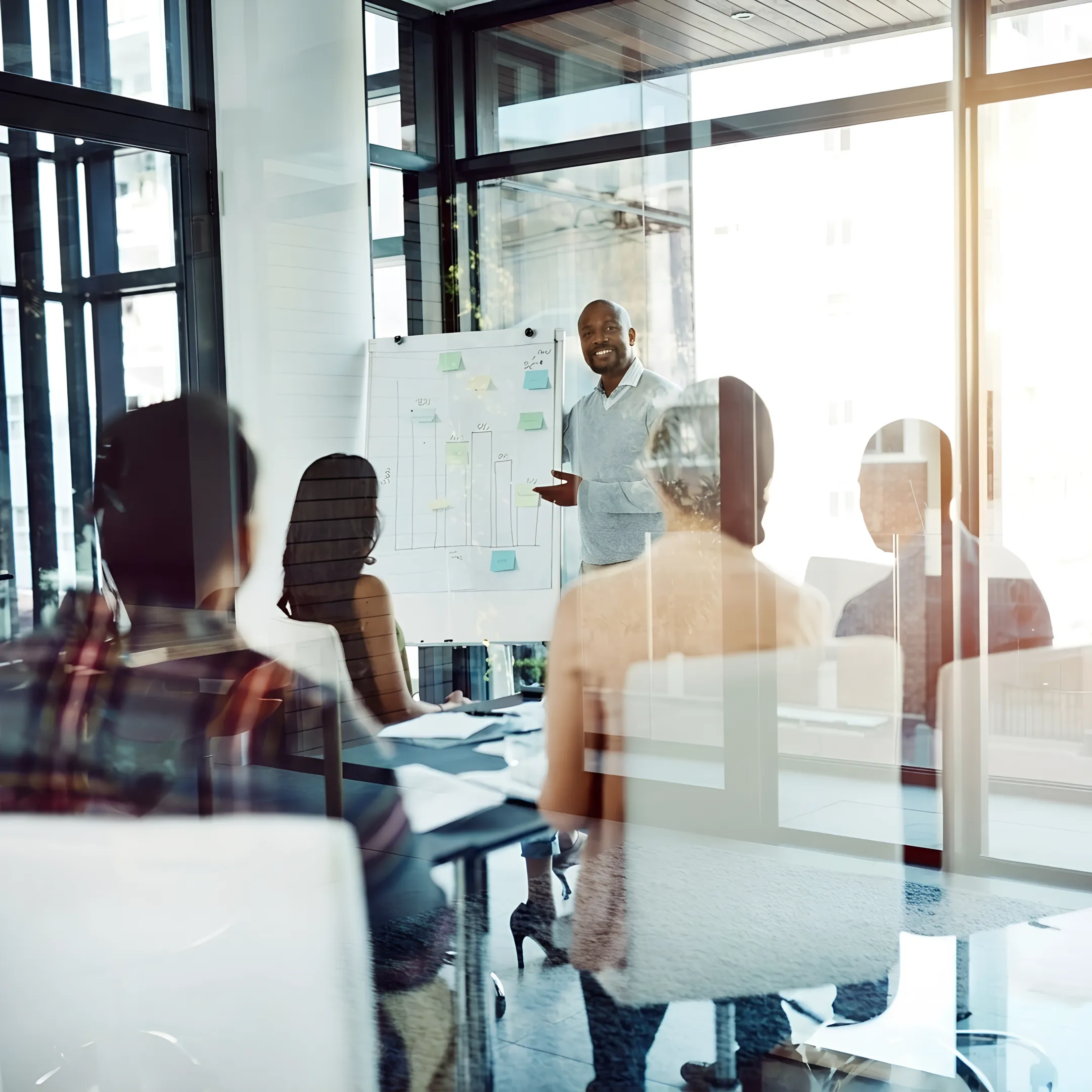 Executive coach mentoring senior business leader in a modern office