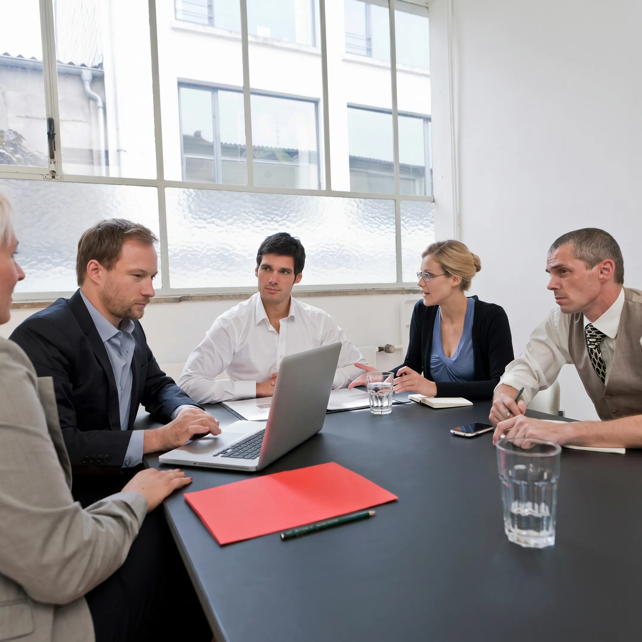 Business consultants facilitating a strategic enterprise performance mapping session with cross-functional managers