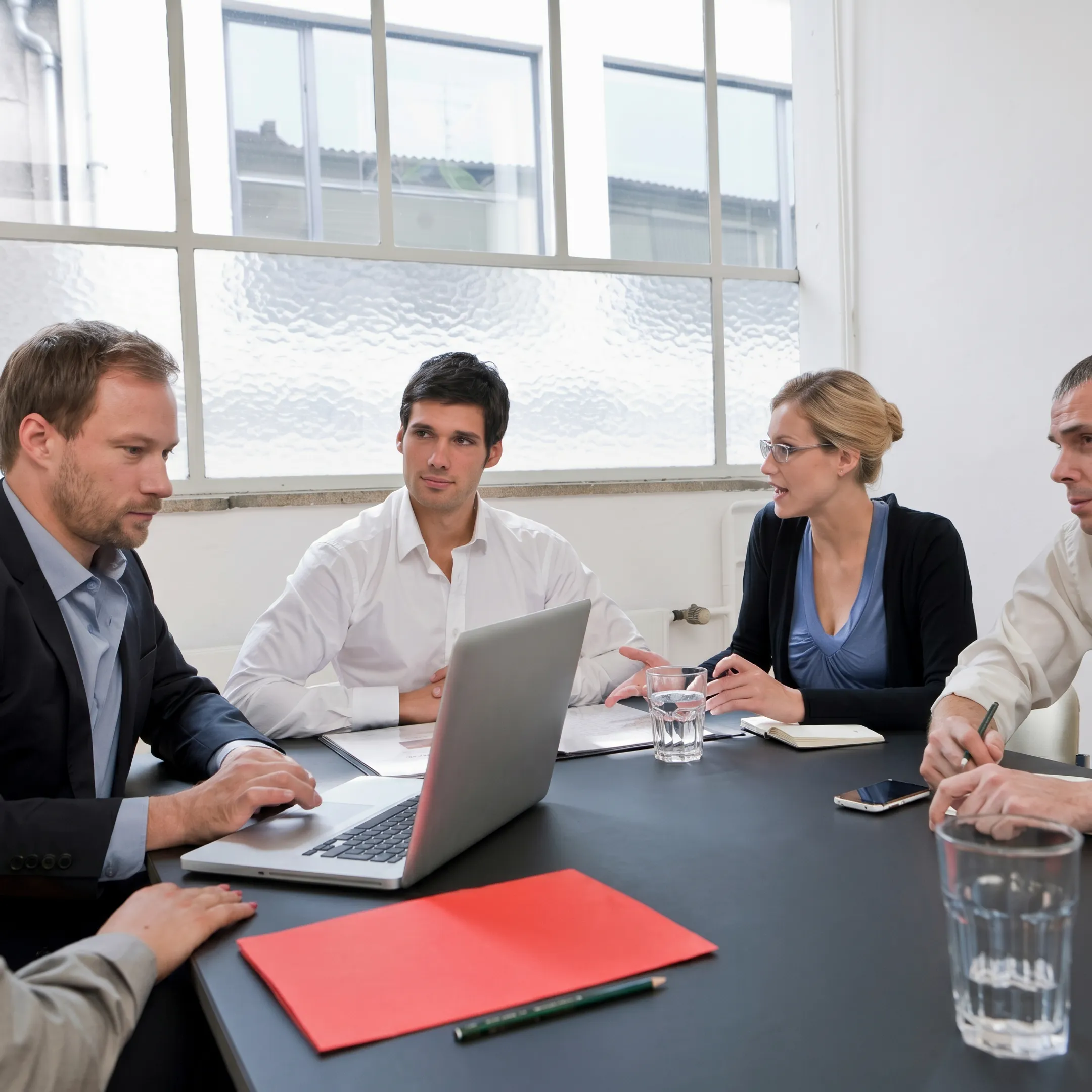 Consultants reviewing supply chain value stream maps and operational data