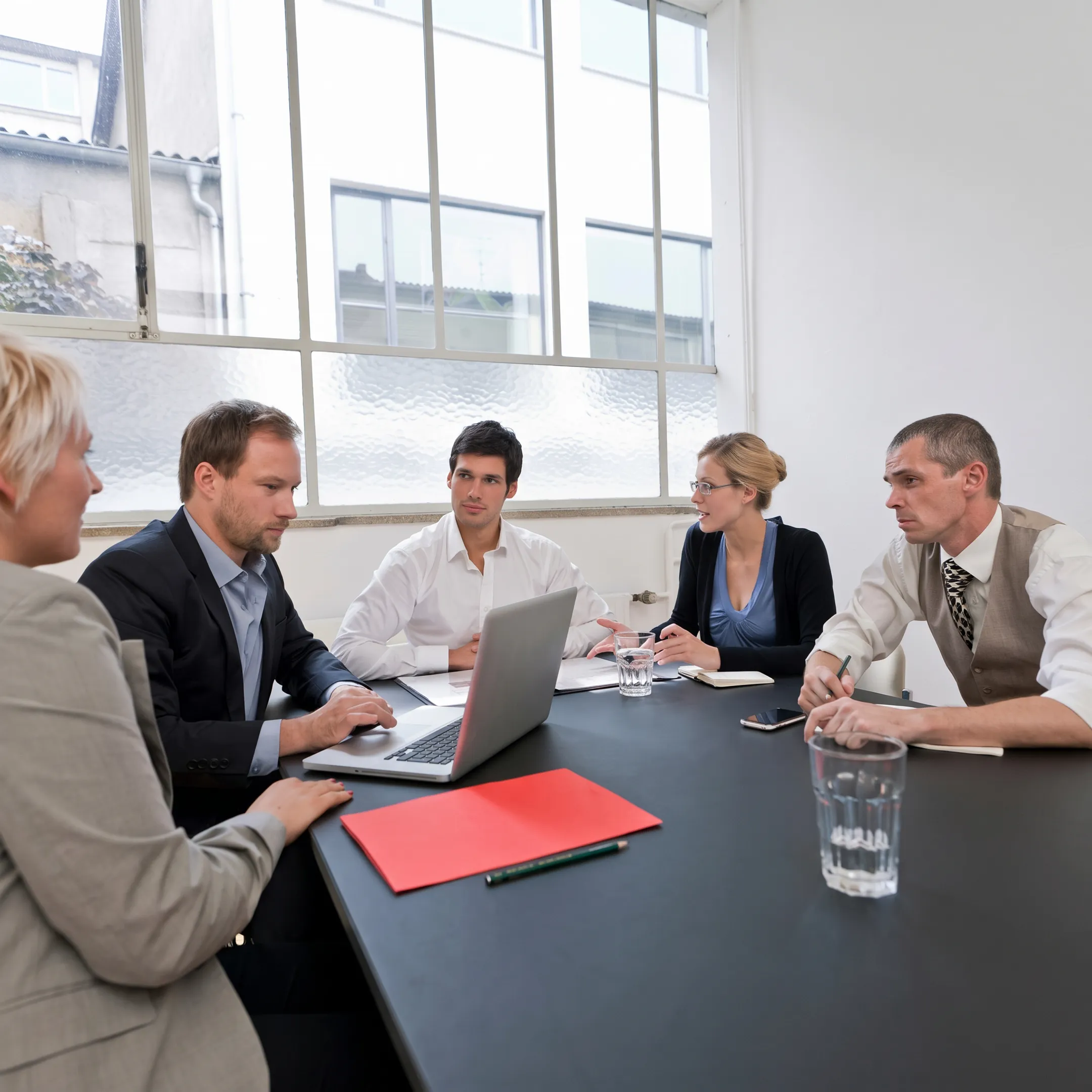 Supervisor coaching floor employees during a process improvement session