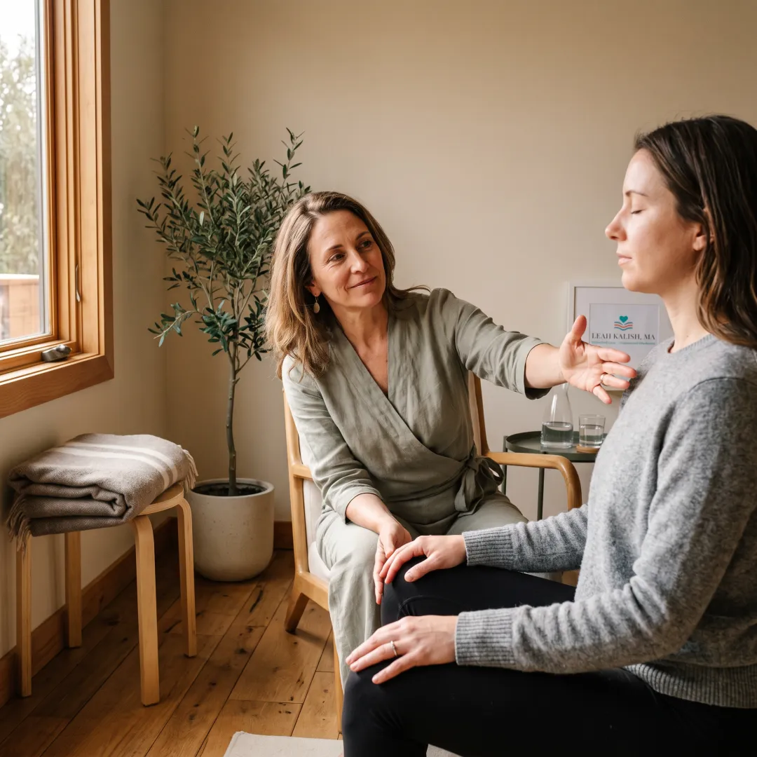 Client practicing calm body awareness with a somatic coach