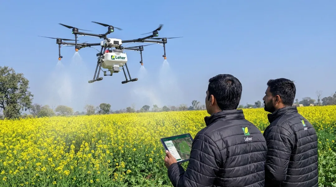 Leher drone spraying service over Indian crop field guided by GIS mapping