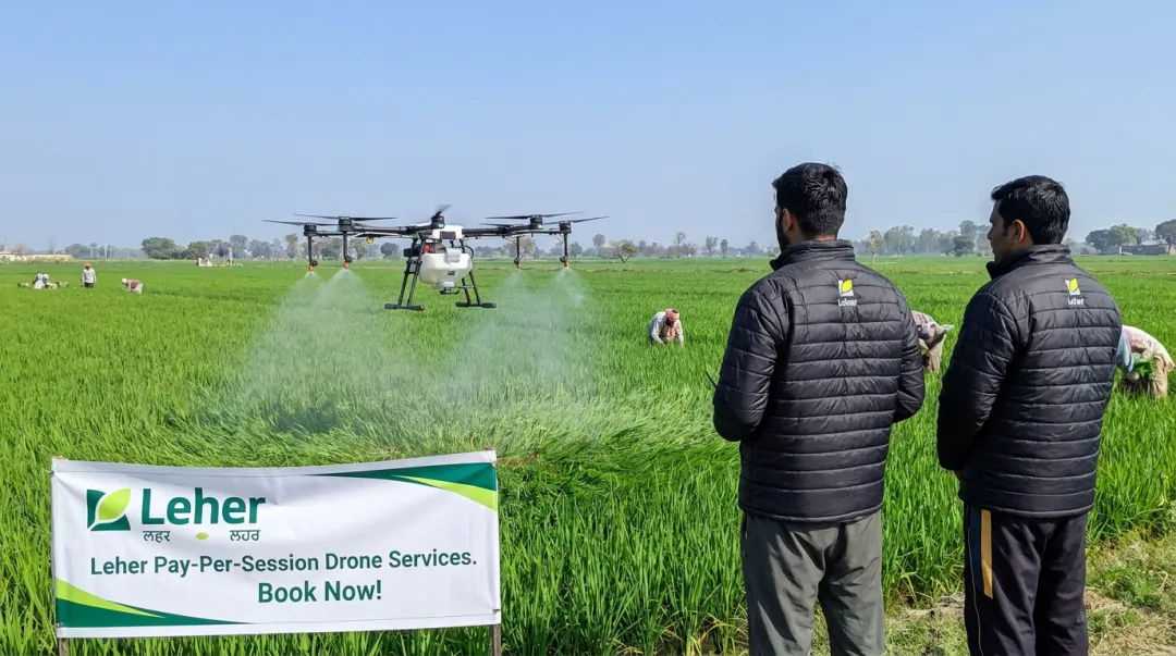 Leher drone spraying service in operation over Indian crop field