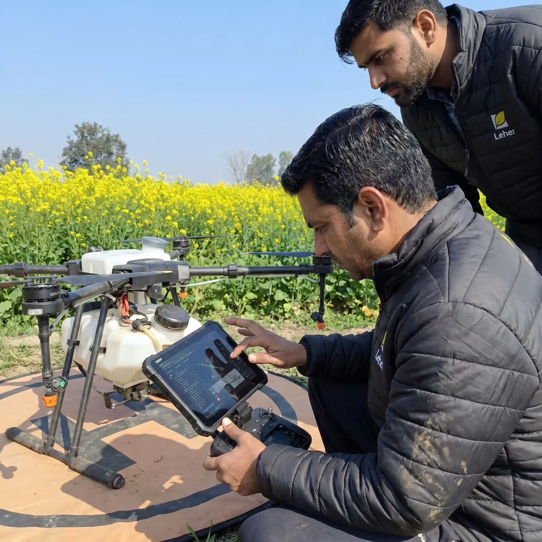 Drone pilot preparing crop spraying equipment