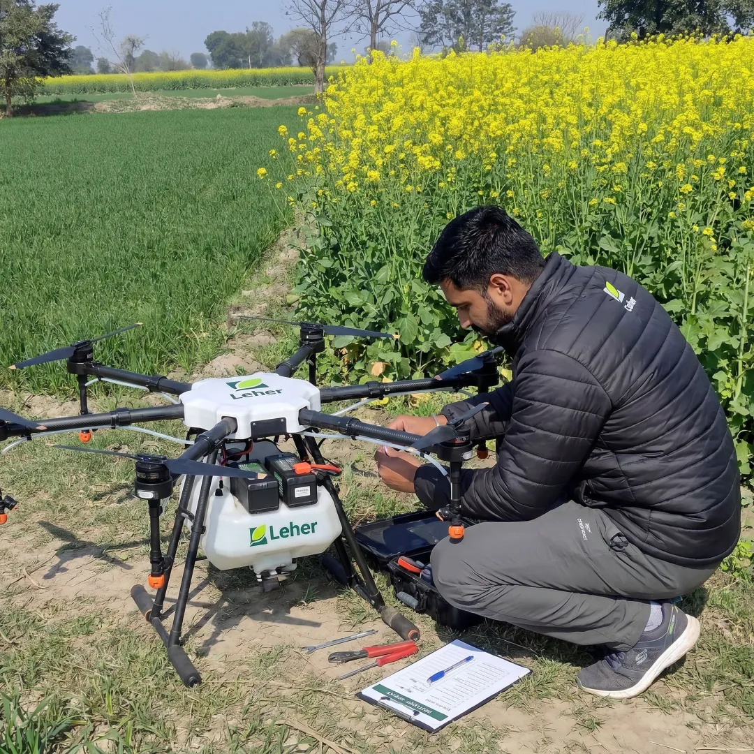 Drone pilot preparing crop spraying equipment