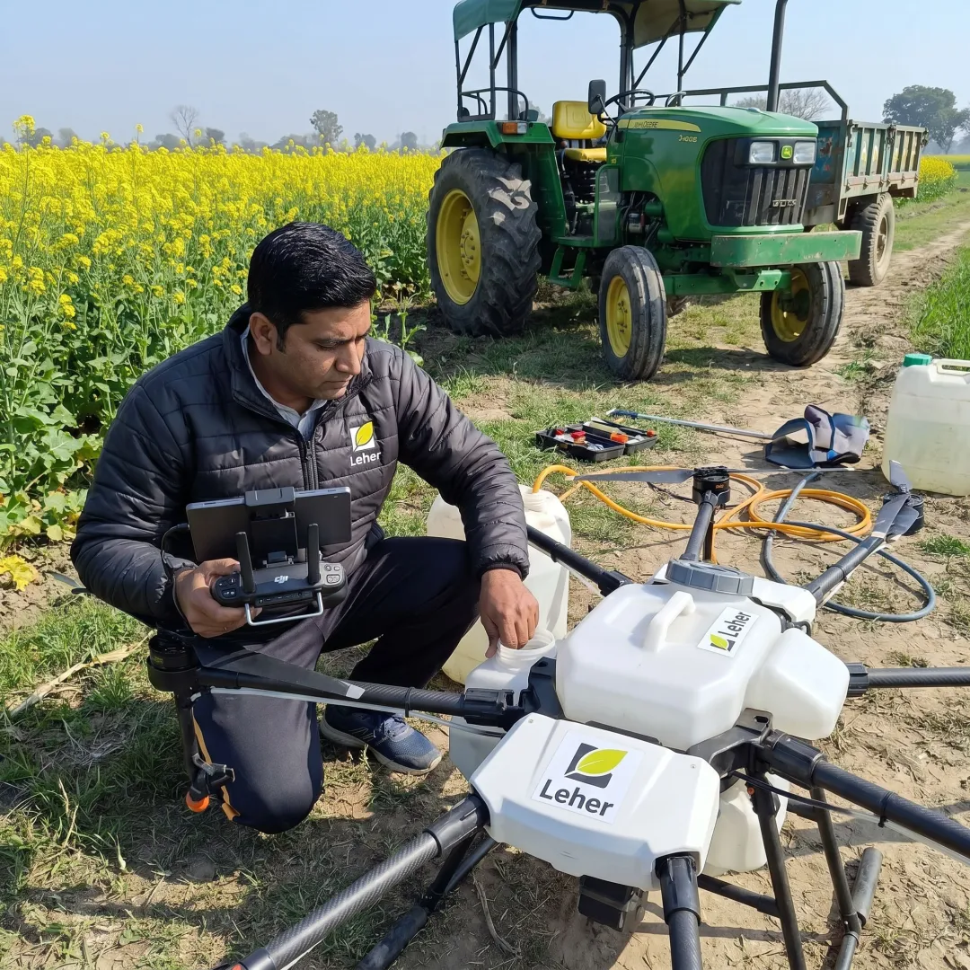 Drone pilot preparing agricultural spraying drone