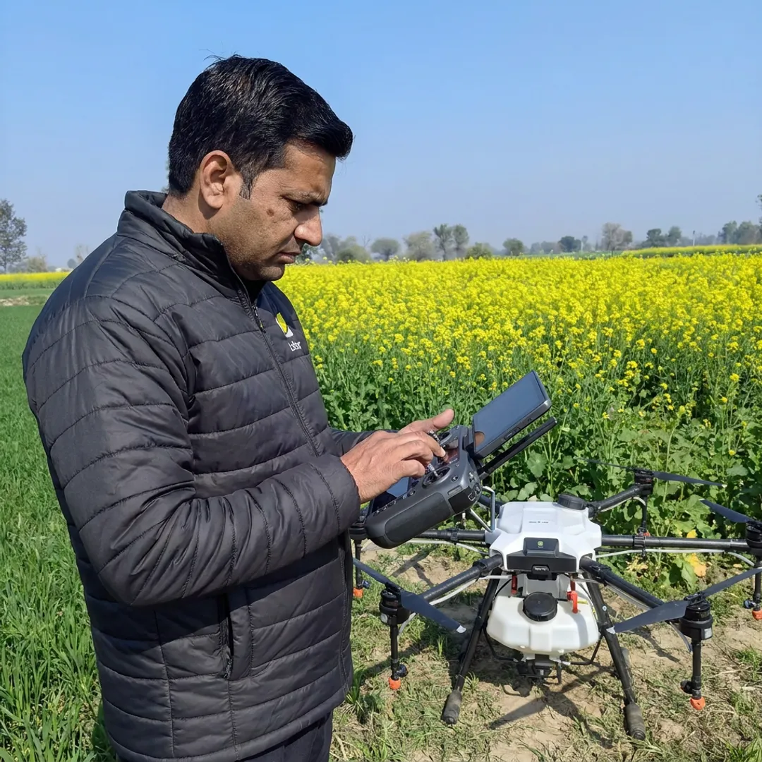 Drone pilot preparing farm spraying equipment