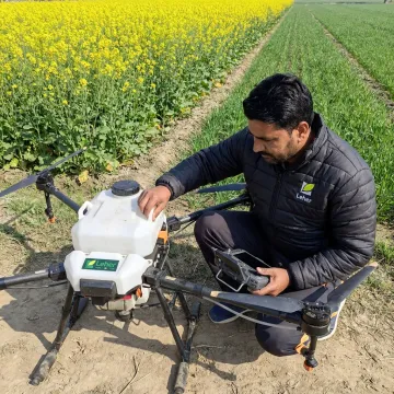 Drone pilot preparing farm spraying operation