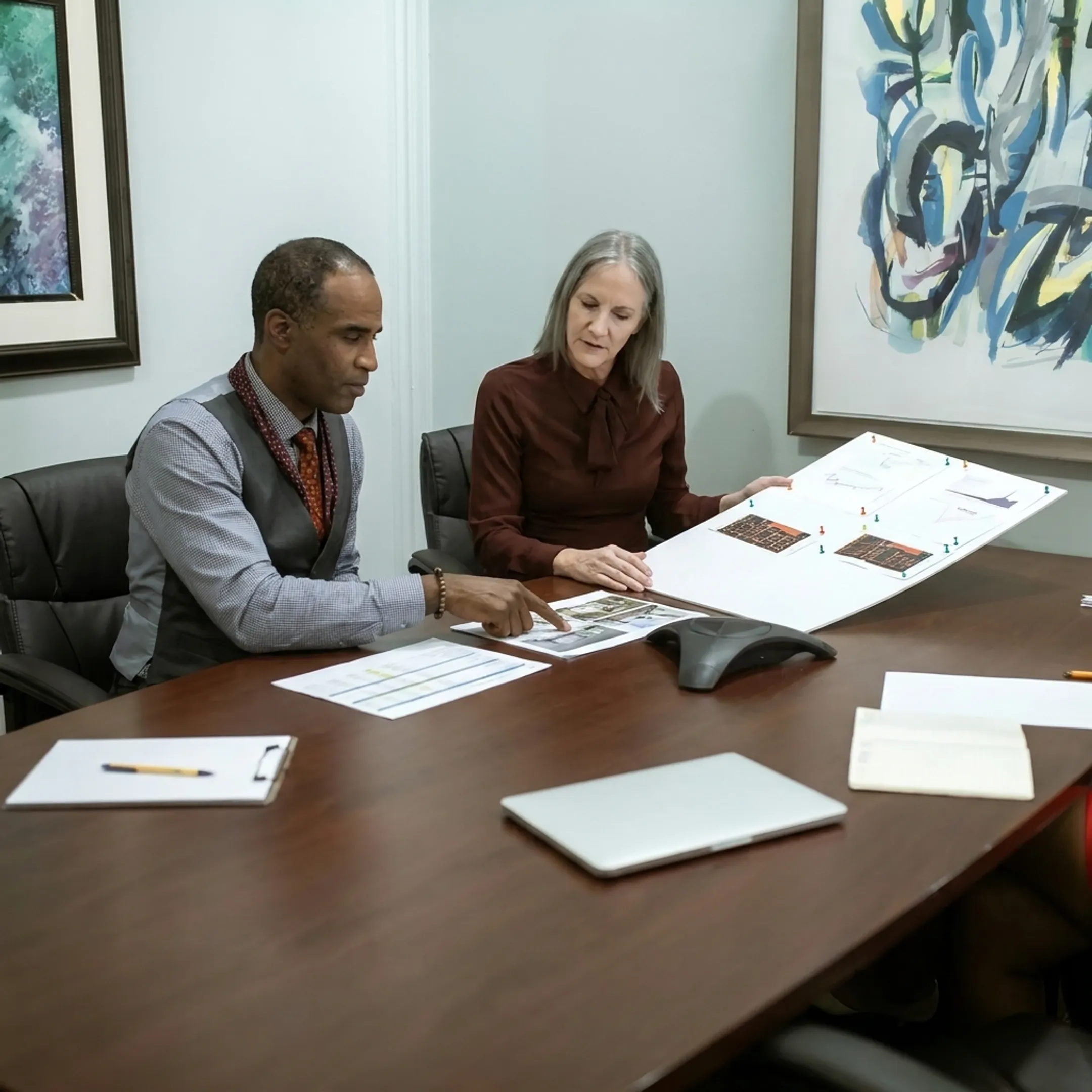 Real estate investor discussing a property financing plan