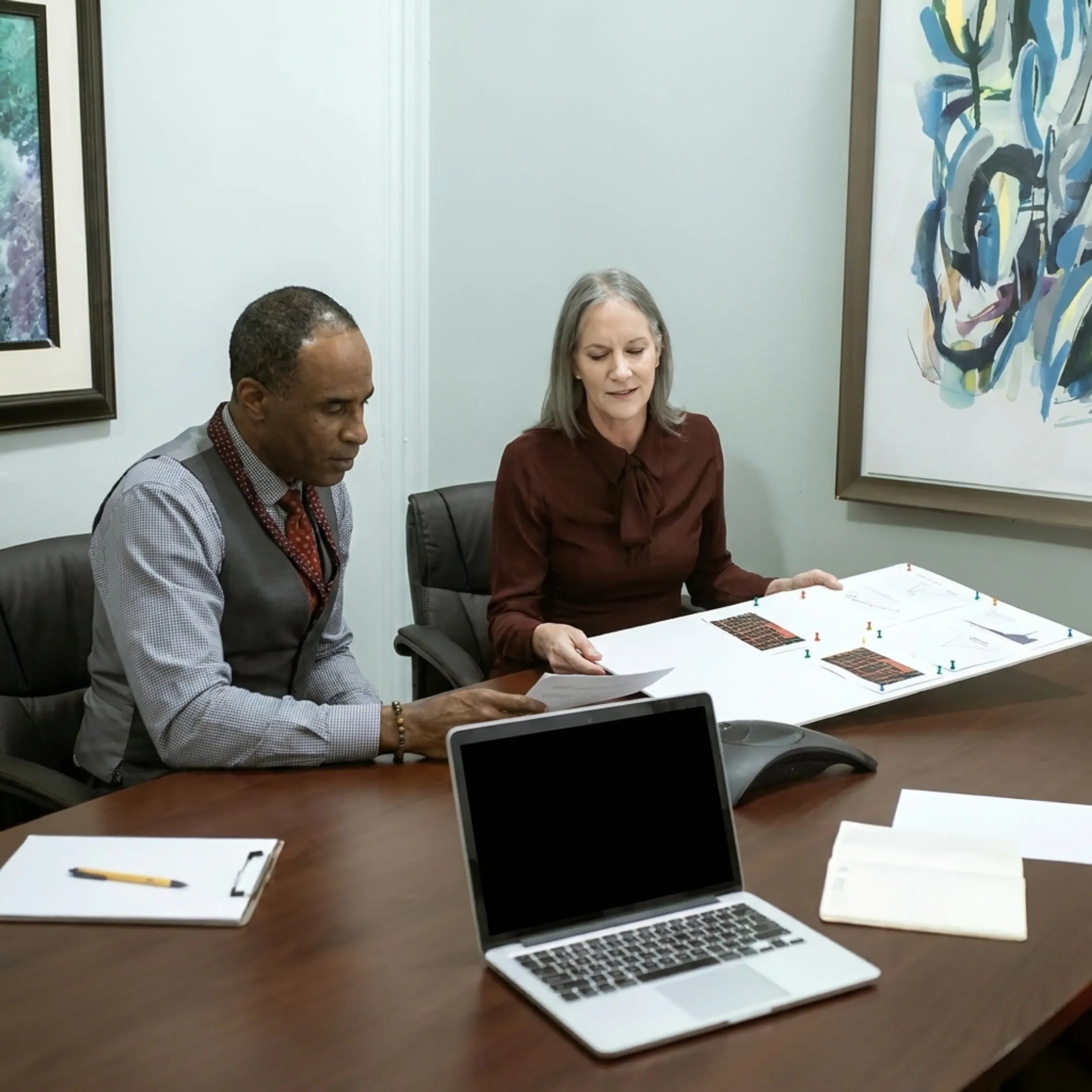 Funding specialist explaining business loan options to a veteran entrepreneur