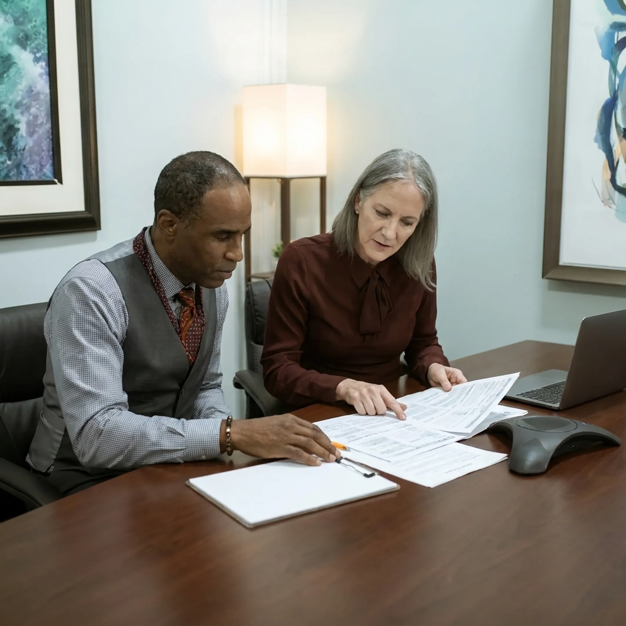 Investor discussing real estate financing with funding specialist