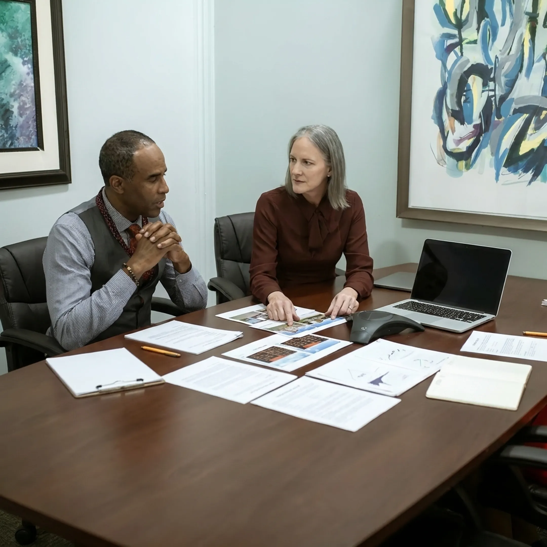 Investor discussing real estate financing strategy with funding specialist