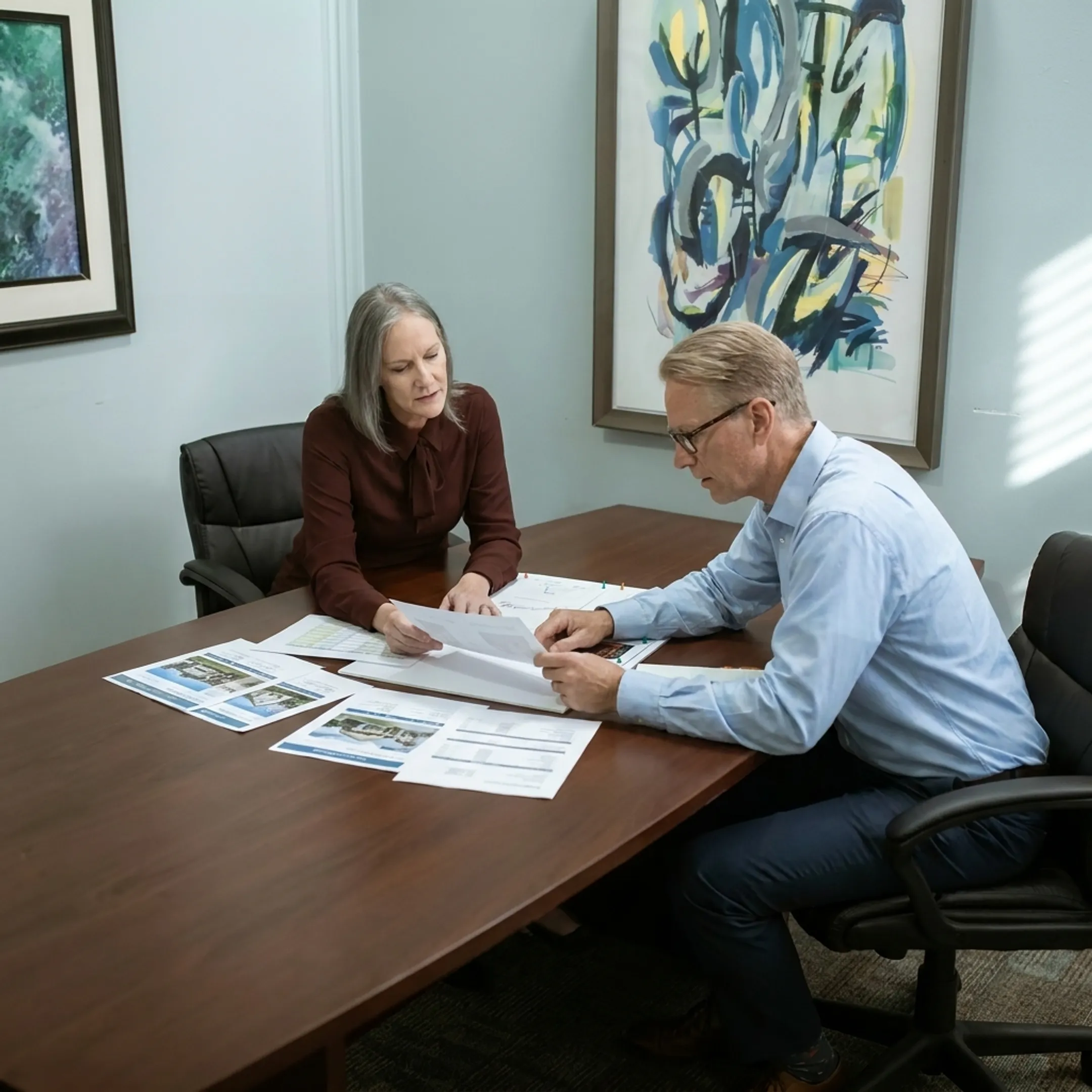 Real estate investor discussing property financing with a funding specialist