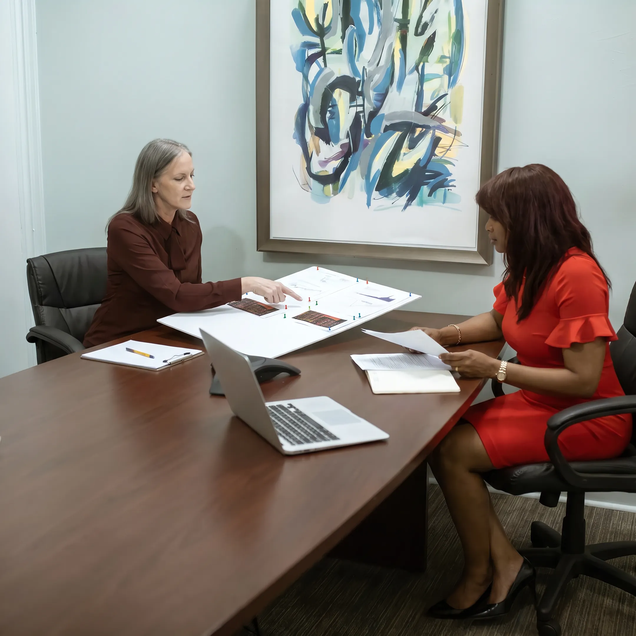 Business owner reviewing office equipment financing options with a funding specialist