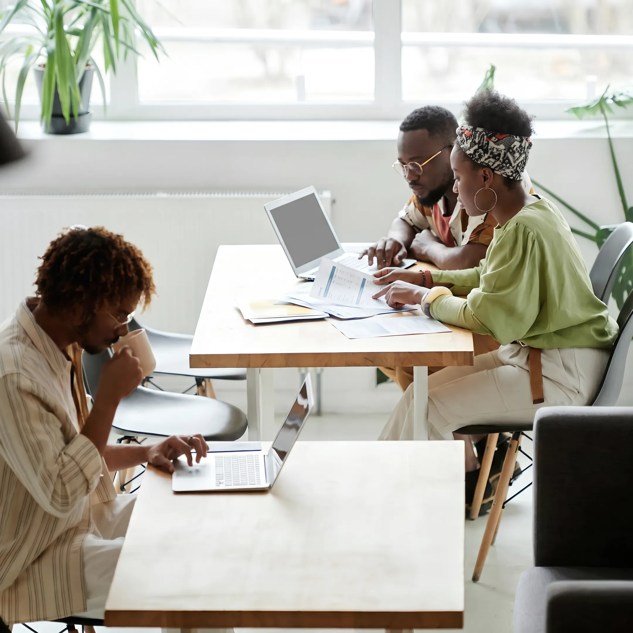 Small-business owner reviewing funding options with a financial specialist