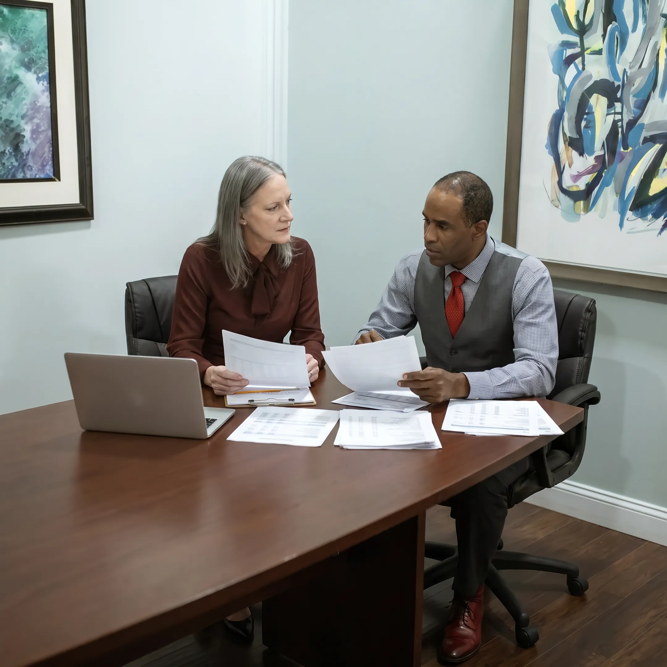 Business owner reviewing working capital financing documents with a funding specialist