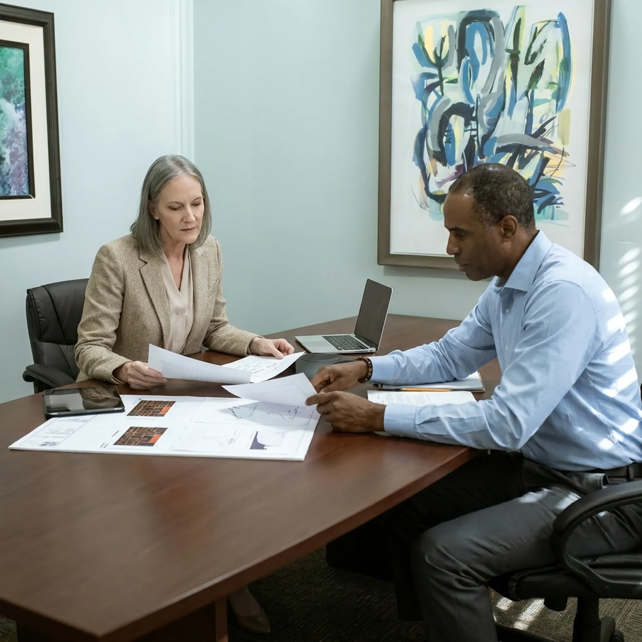 Funding specialist discussing an investment property loan with a real estate investor