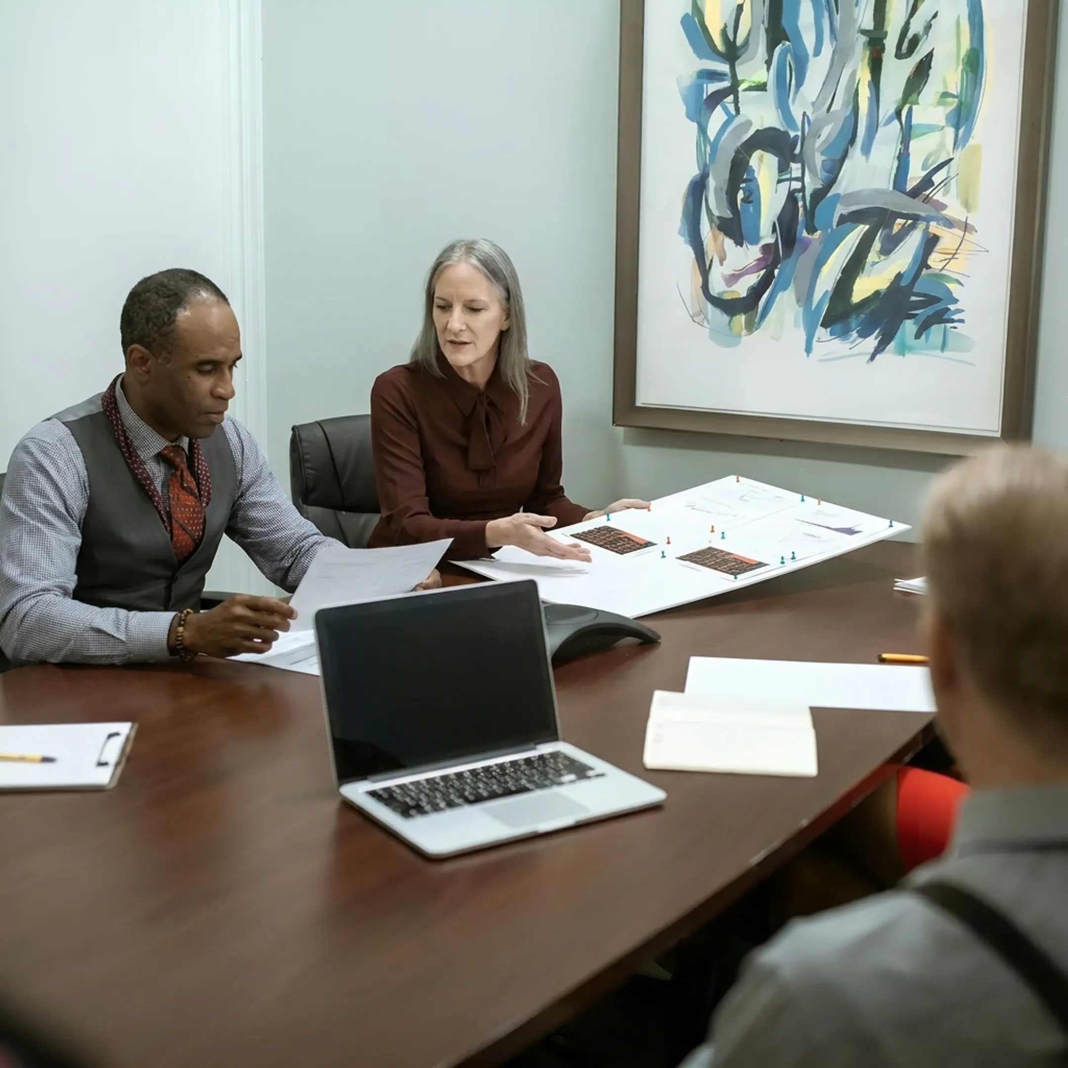 Funding specialist discussing transport equipment financing with business owner