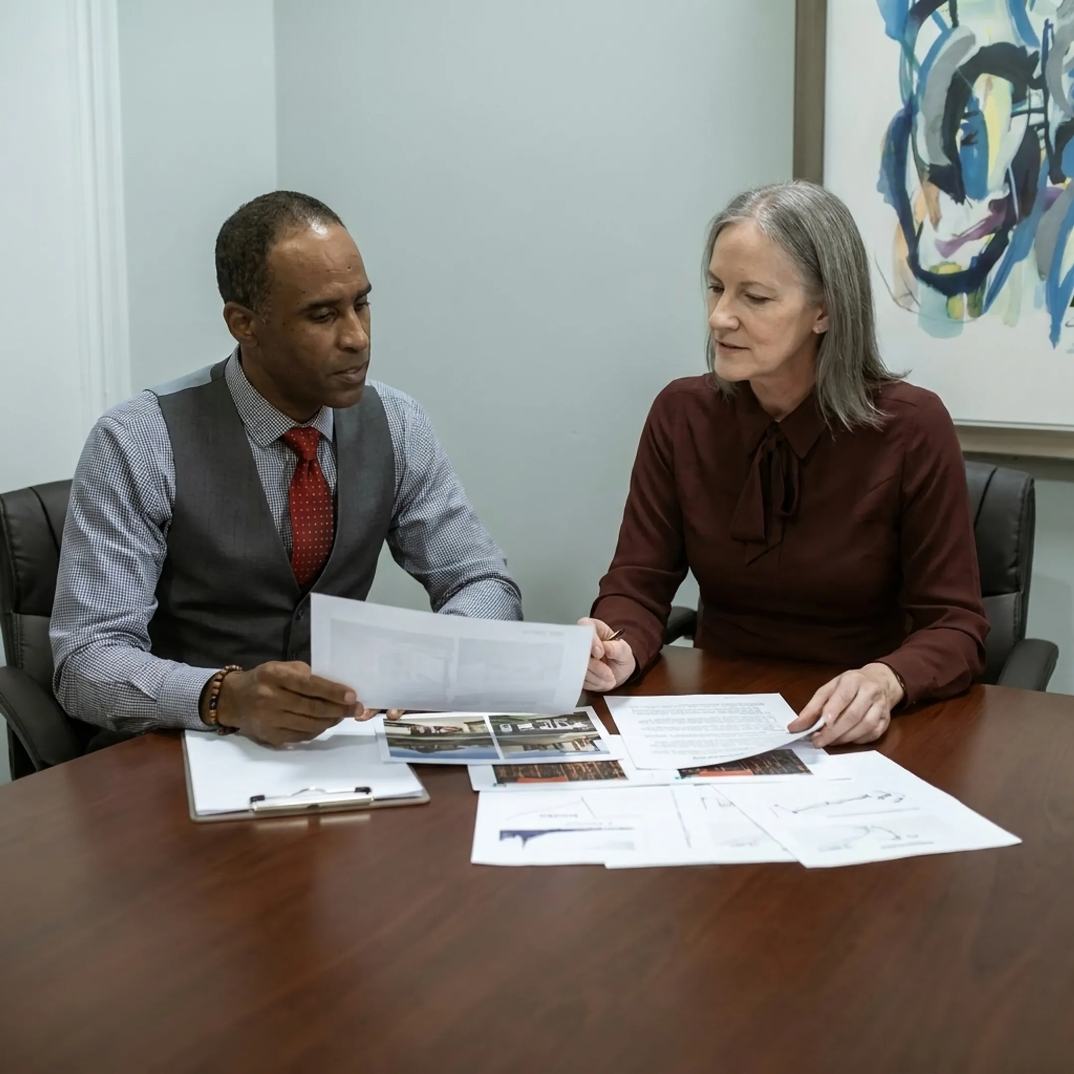 Funding specialist discussing real estate bridge financing with an investor