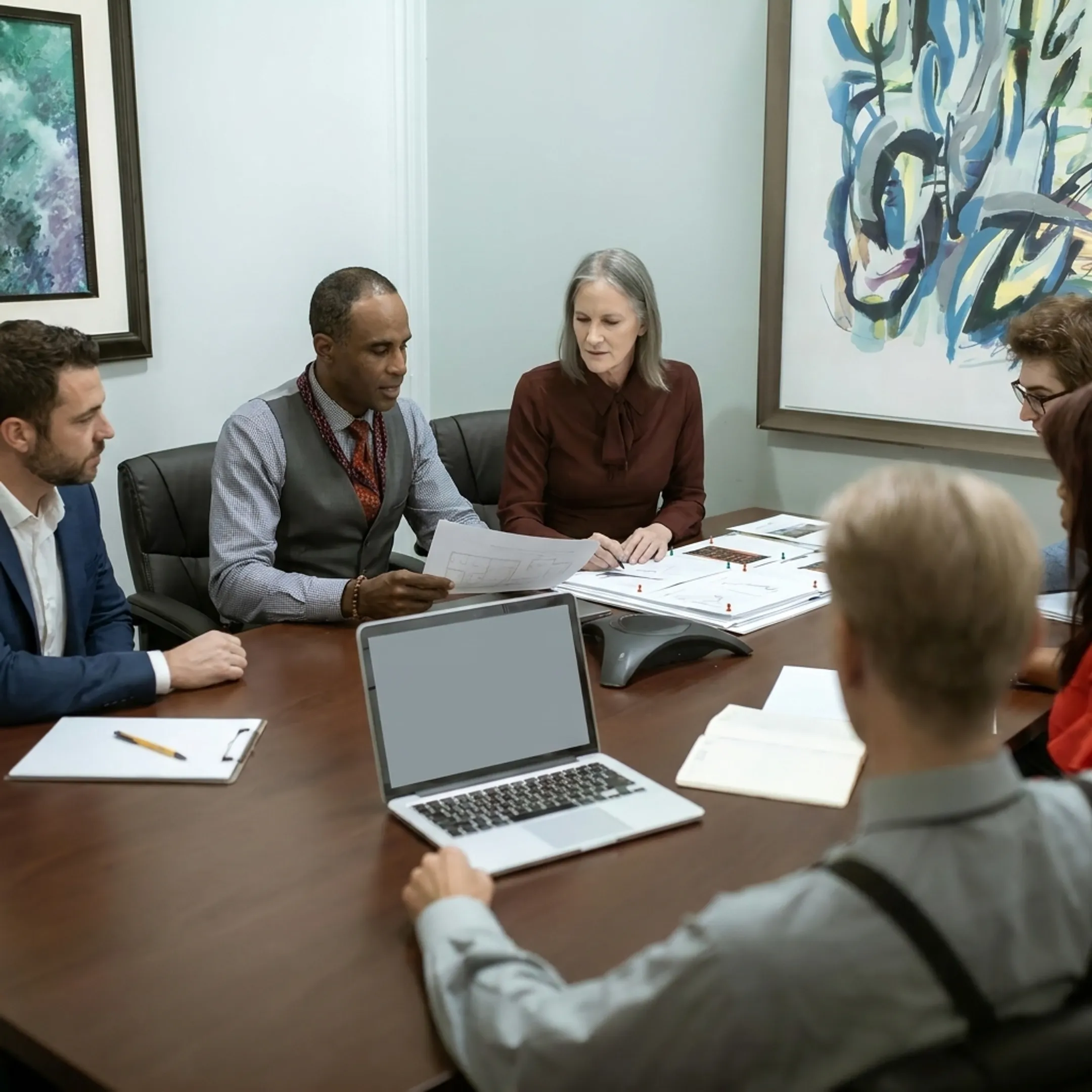 Investor discussing real estate funding with a financing specialist