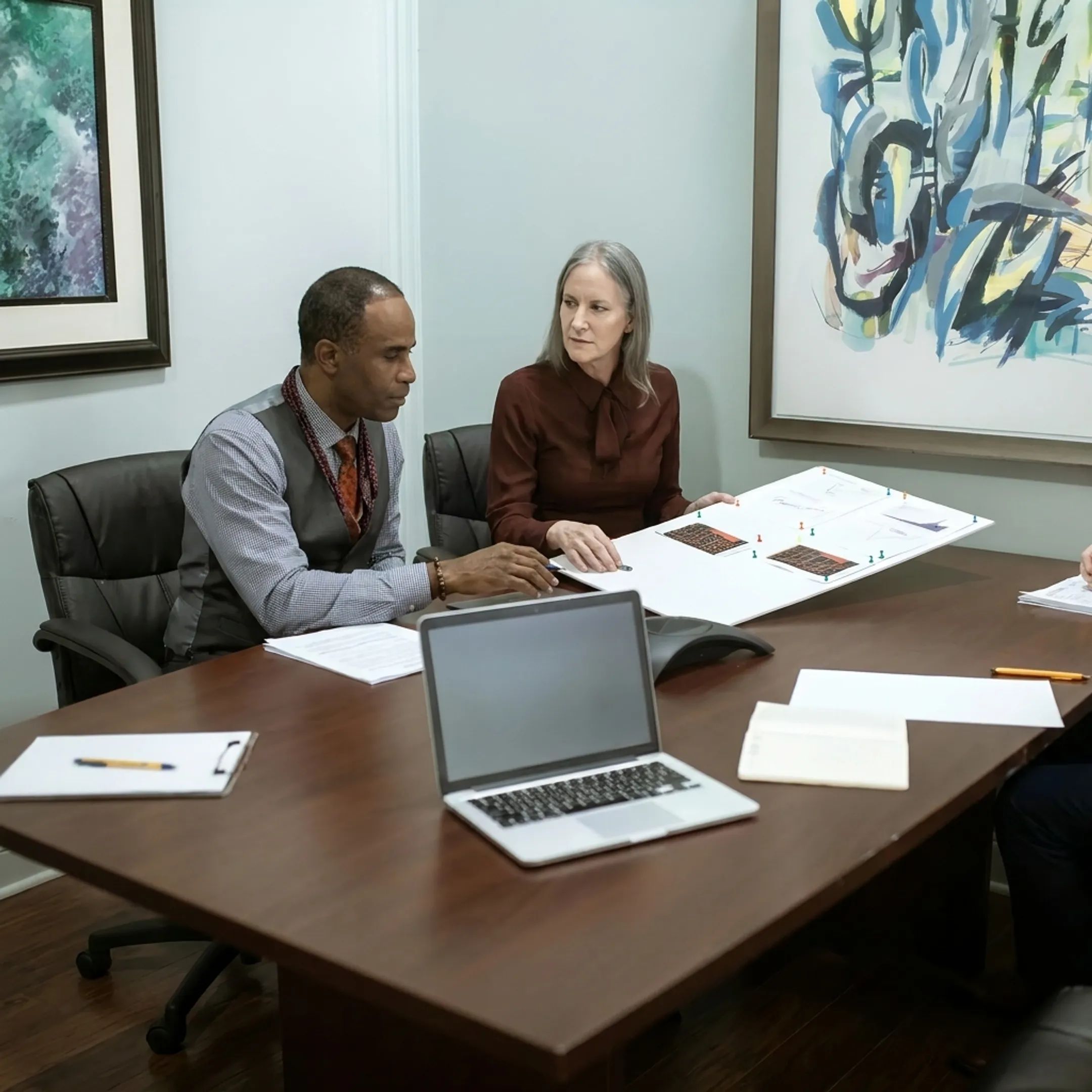 Advisor discussing commercial property financing with an investor