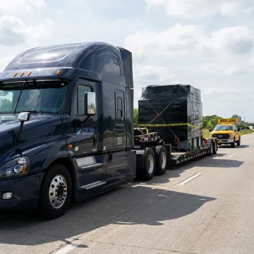 Heavy equipment loaded on a double drop trailer