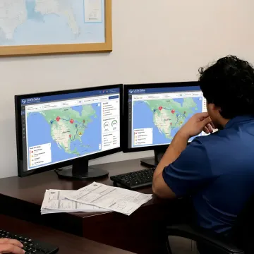 Dispatcher tracking hazmat freight on logistics monitors