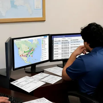 Dispatcher coordinating dry van truckload delivery