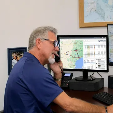 Dispatcher tracking urgent freight delivery