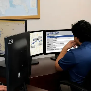 Logistics coordinator tracking white glove freight delivery